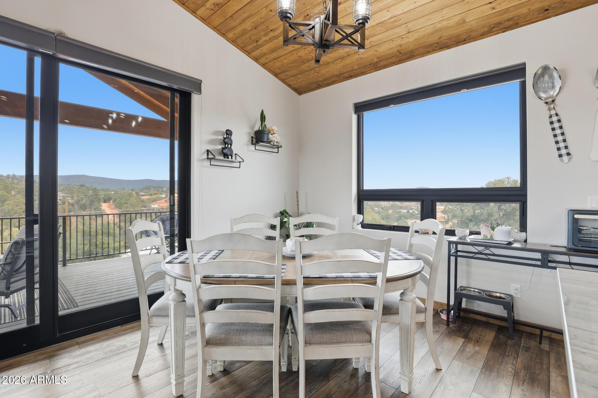 210 Valley Road Payson, AZ 85541 - Photo 11 of 38 a view of a dining room with furniture window and wooden floor