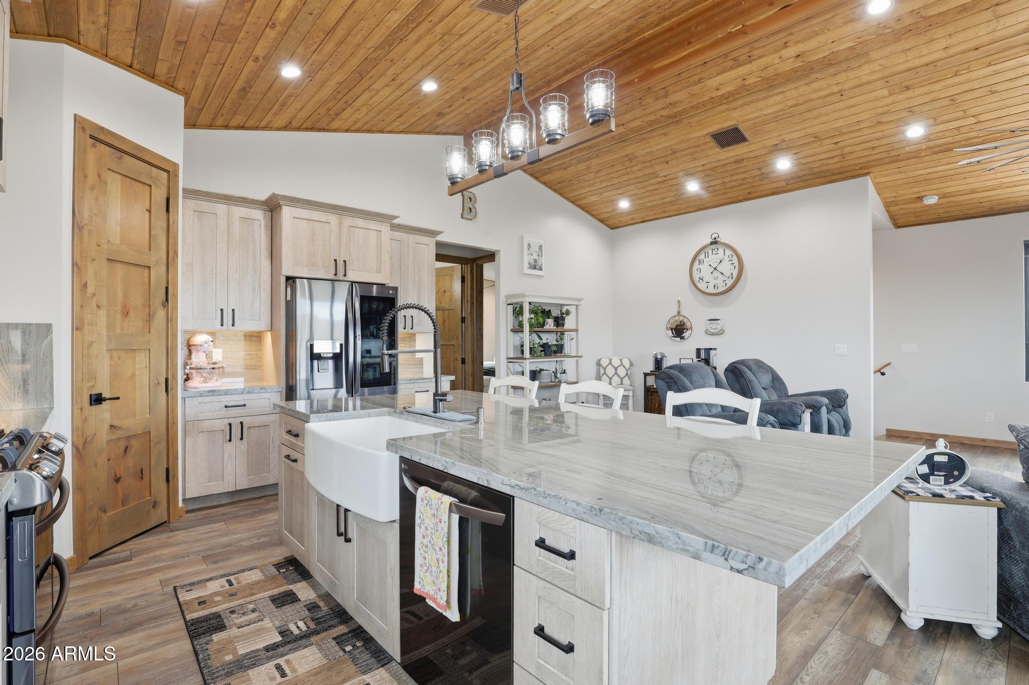 210 Valley Road Payson, AZ 85541 - Photo 13 of 38 a kitchen with stainless steel appliances granite countertop a sink refrigerator and cabinets