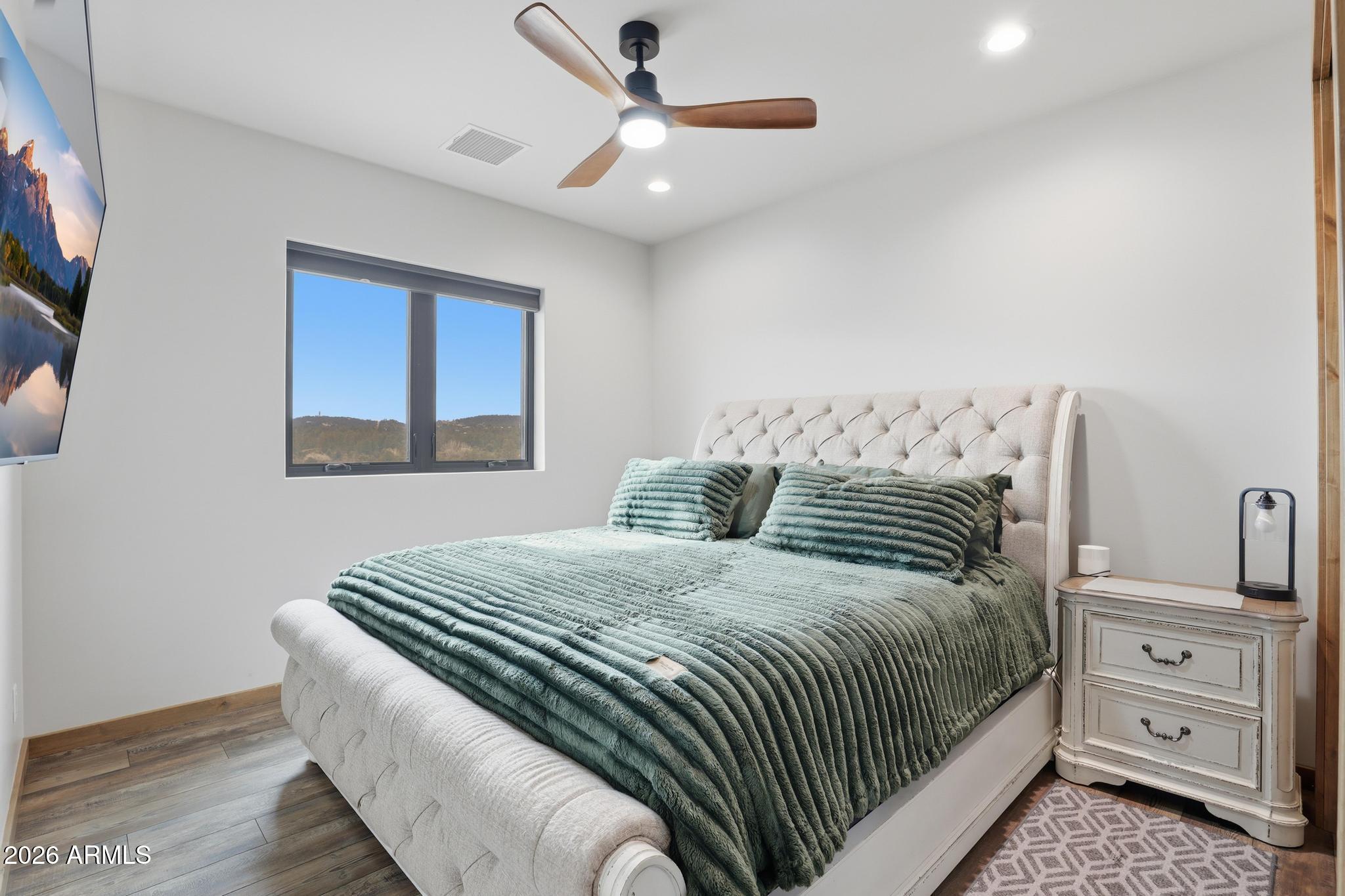 210 Valley Road Payson, AZ 85541 - Photo 16 of 38 a bedroom with a large bed and a window