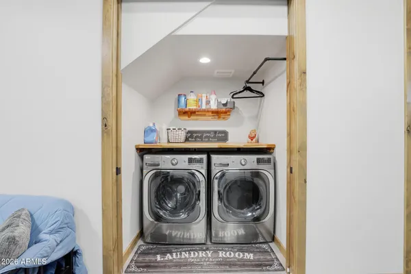 a utility room with dryer and washer