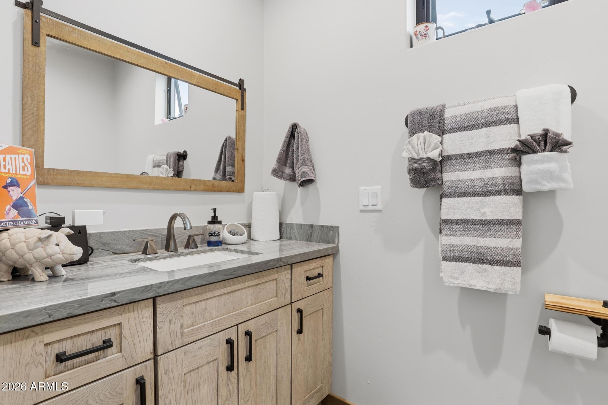 210 Valley Road Payson, AZ 85541 - Photo 25 of 38 a bathroom with a granite countertop sink and a mirror