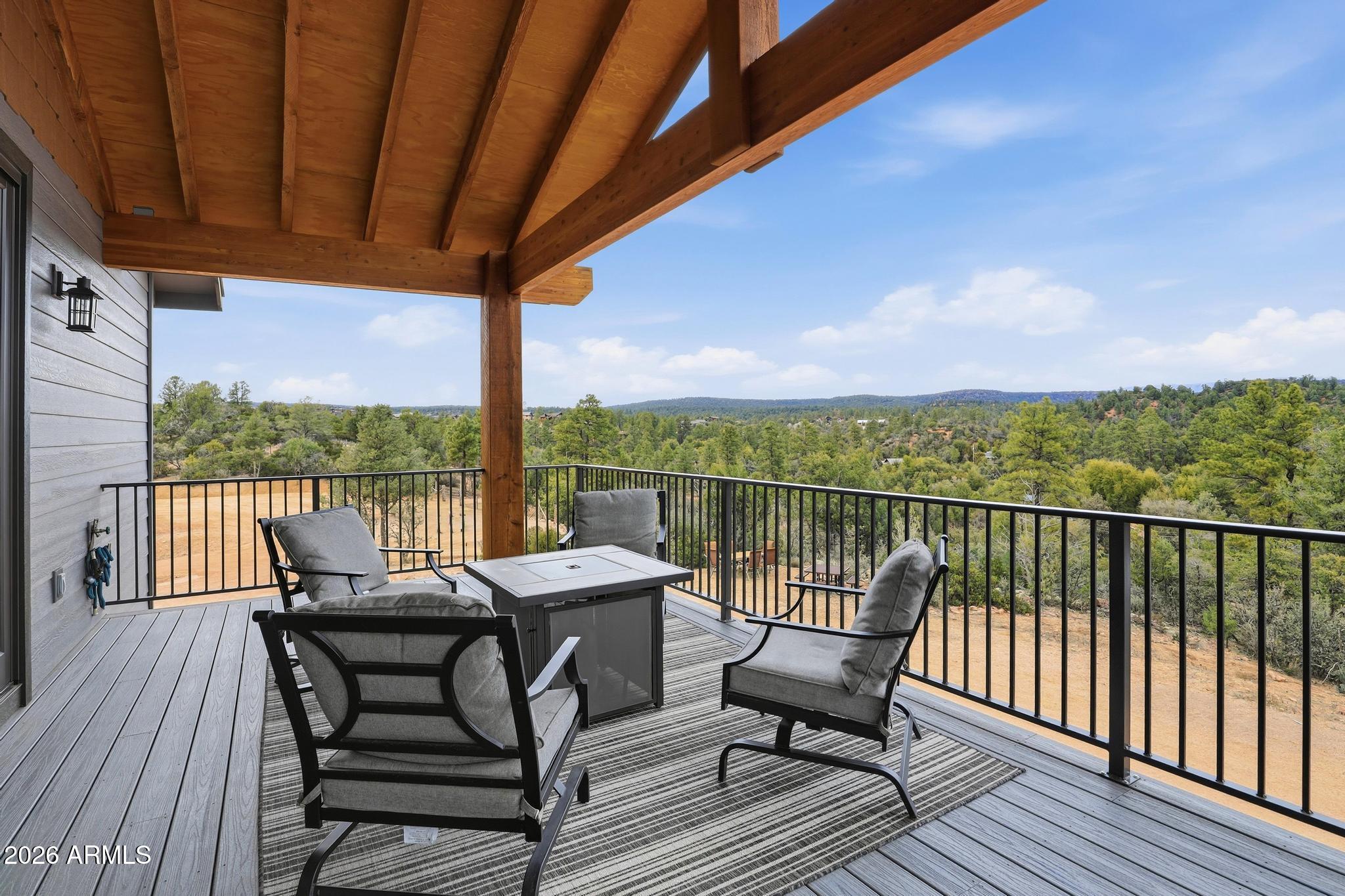 210 Valley Road Payson, AZ 85541 - Photo 4 of 38 a view of a balcony with furniture and wooden floor