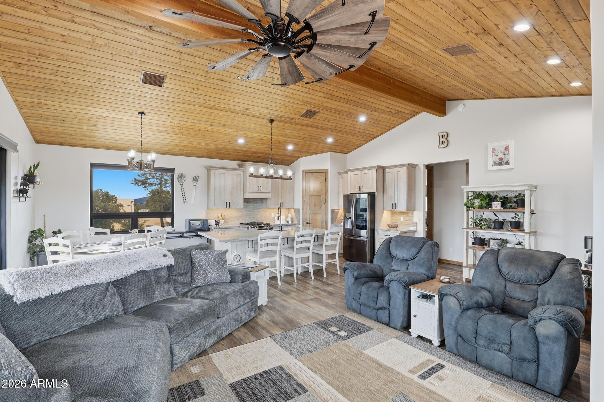 210 Valley Road Payson, AZ 85541 - Photo 9 of 38 a living room with lots of furniture and a chandelier
