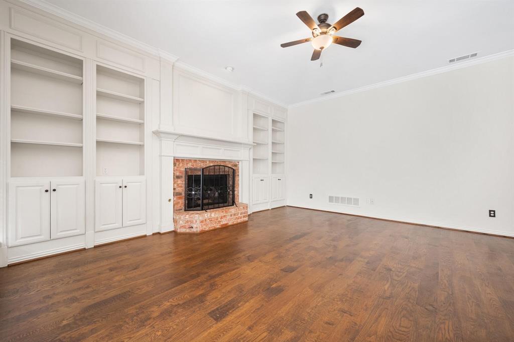 4512 Crown Ridge Drive Plano, TX 75024 - Photo 15 of 32 a view of empty room with a fireplace and window