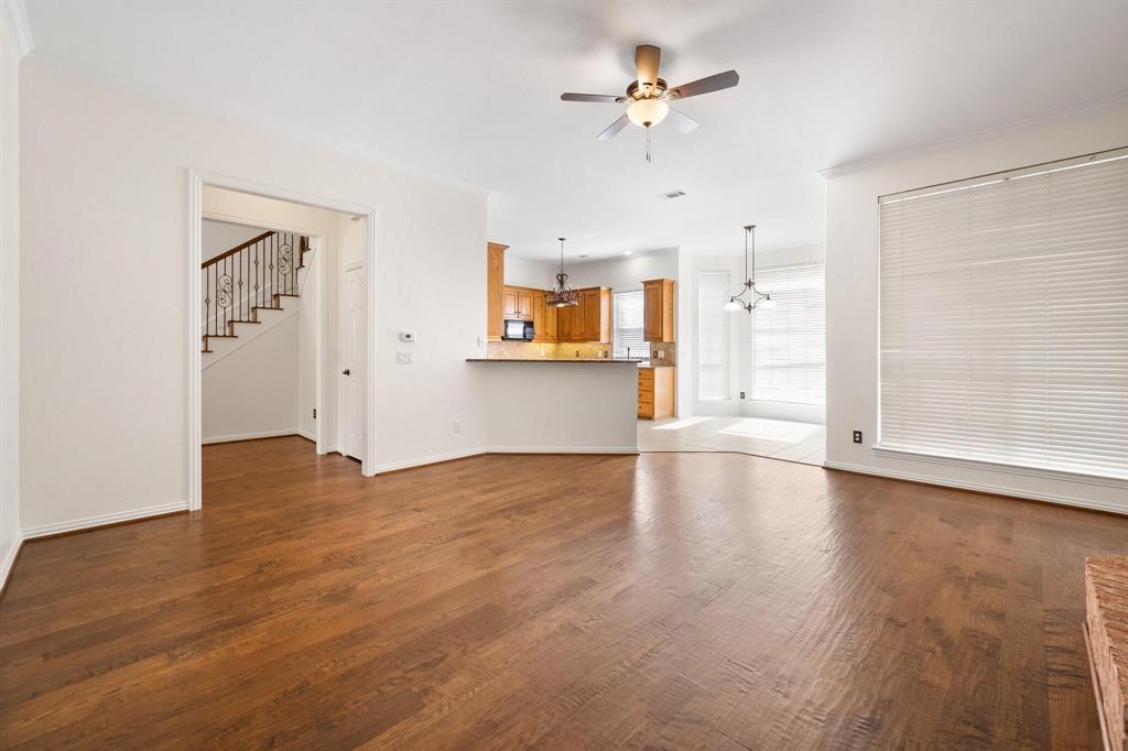 4512 Crown Ridge Drive Plano, TX 75024 - Photo 18 of 32 wooden floor in an empty room with a window