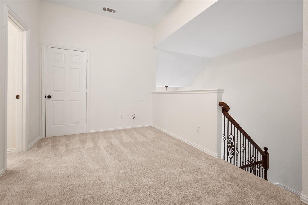 4512 Crown Ridge Drive Plano, TX 75024 - Photo 22 of 32 a view of a hallway with staircase