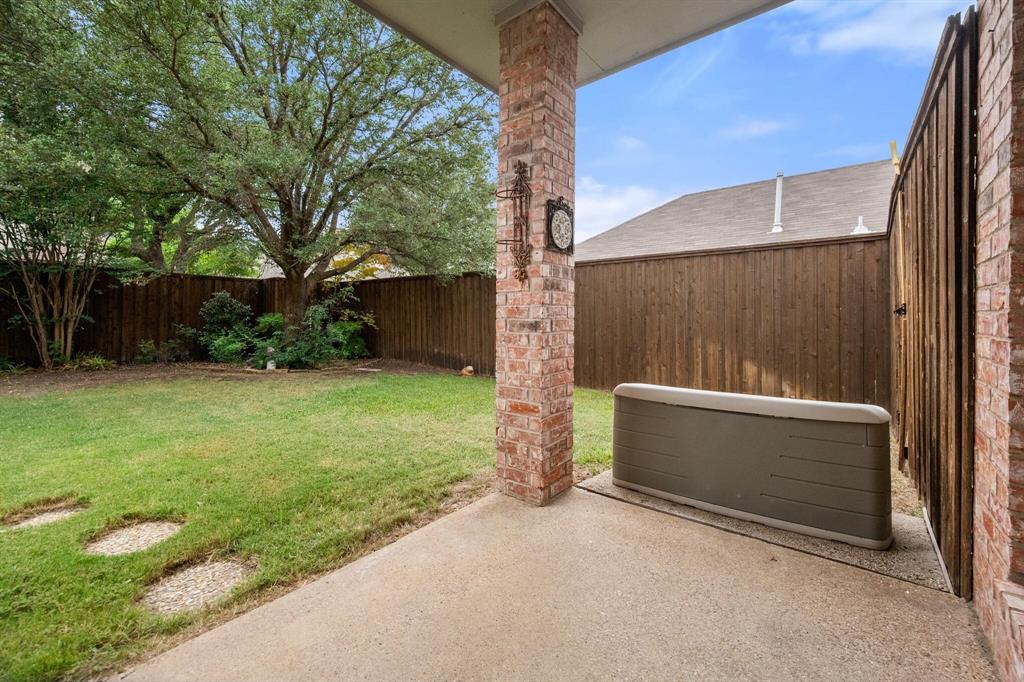 4512 Crown Ridge Drive Plano, TX 75024 - Photo 26 of 32 a view of backyard with tub and trees