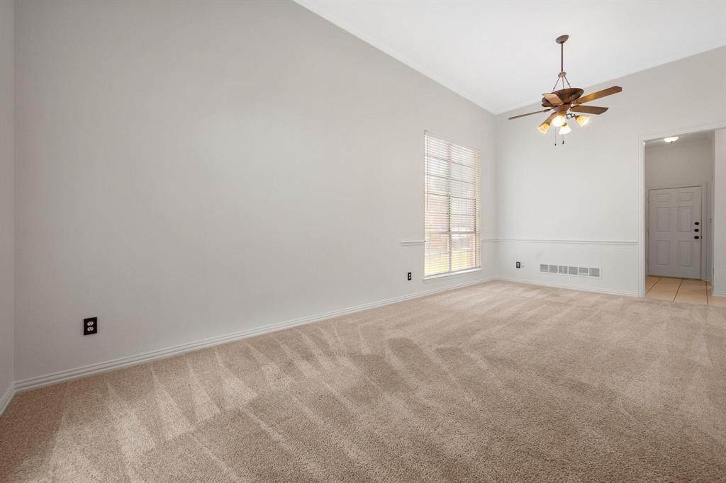 4512 Crown Ridge Drive Plano, TX 75024 - Photo 6 of 32 an empty room with windows and fan