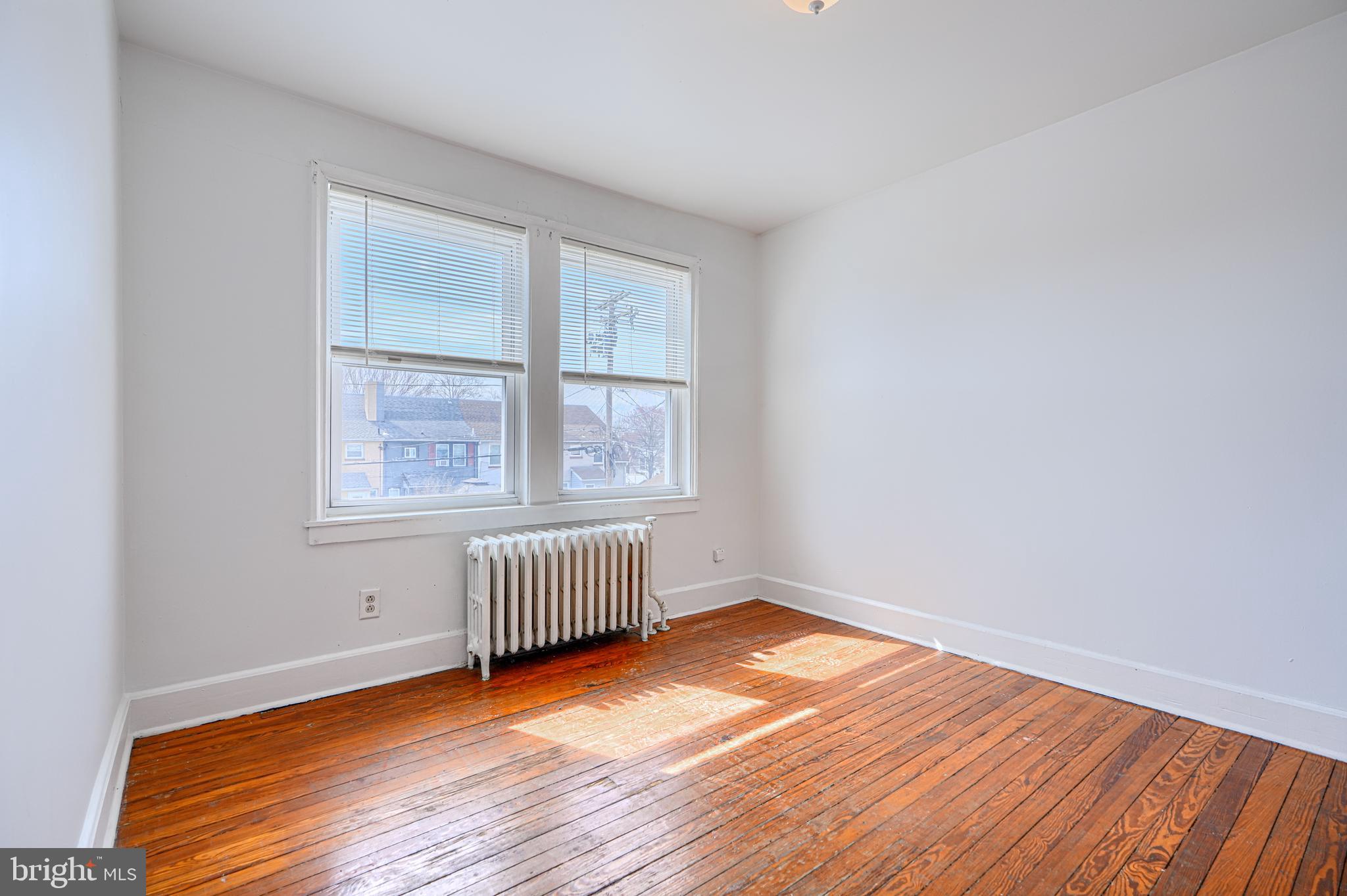 30 Portship Road Baltimore, MD 21222 - Photo 12 of 33 an empty room with wooden floor and windows