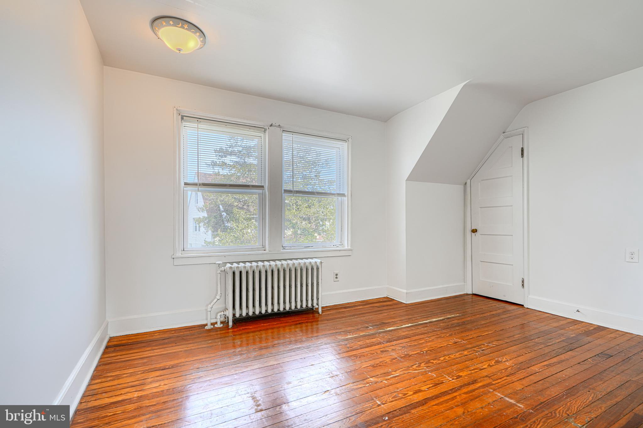 30 Portship Road Baltimore, MD 21222 - Photo 15 of 33 an empty room with wooden floor and windows