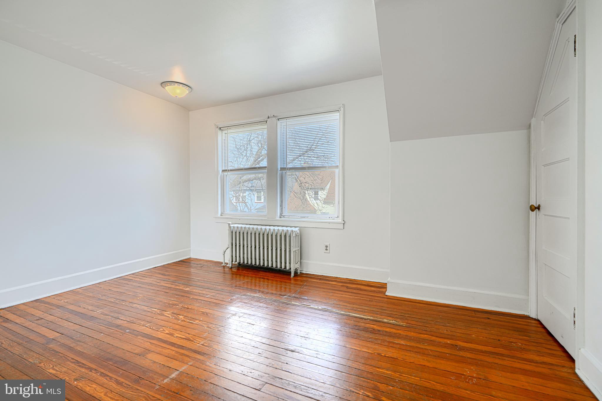 30 Portship Road Baltimore, MD 21222 - Photo 16 of 33 an empty room with wooden floor and windows
