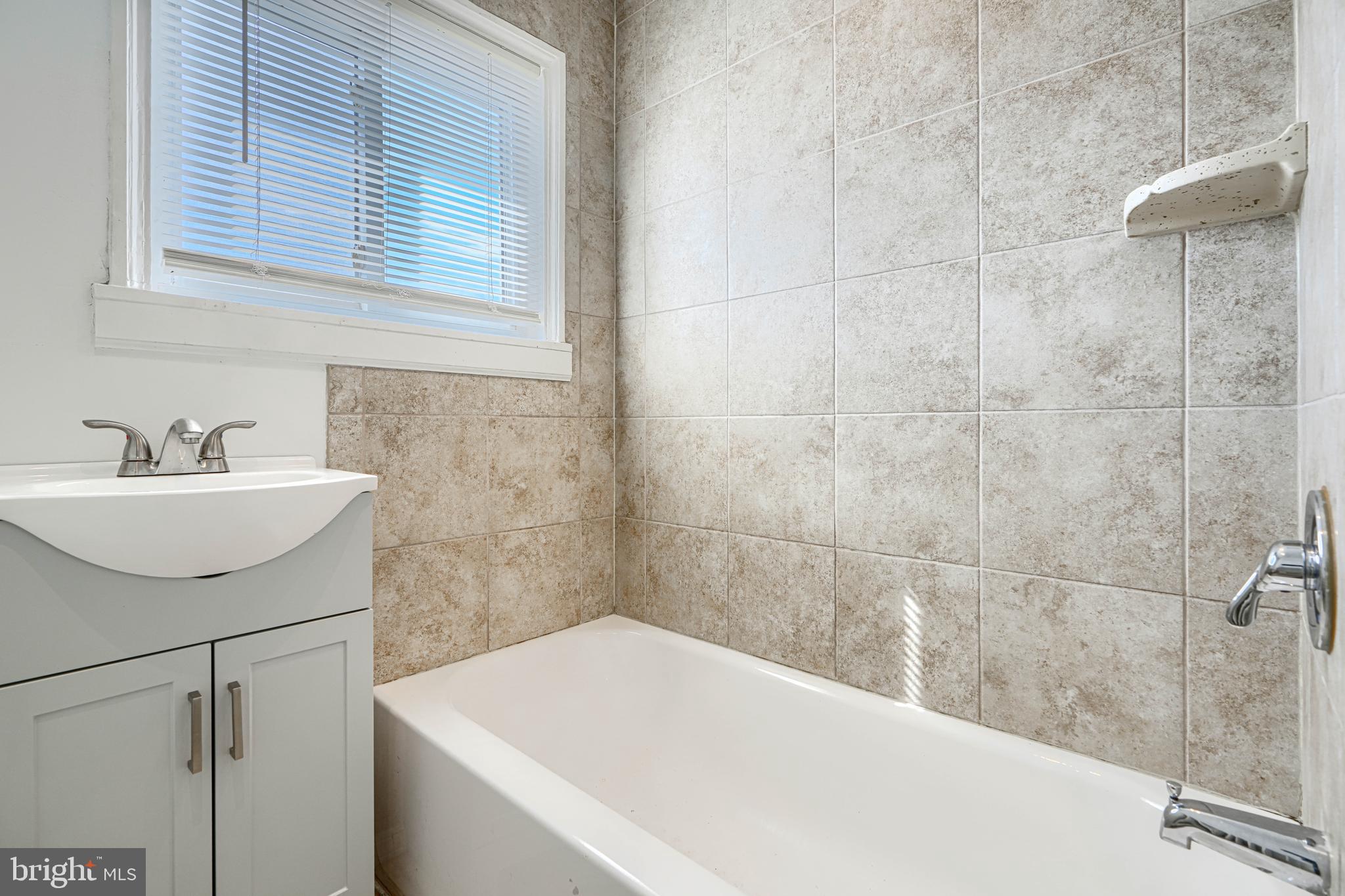30 Portship Road Baltimore, MD 21222 - Photo 20 of 33 a bathroom with a sink and a bathtub