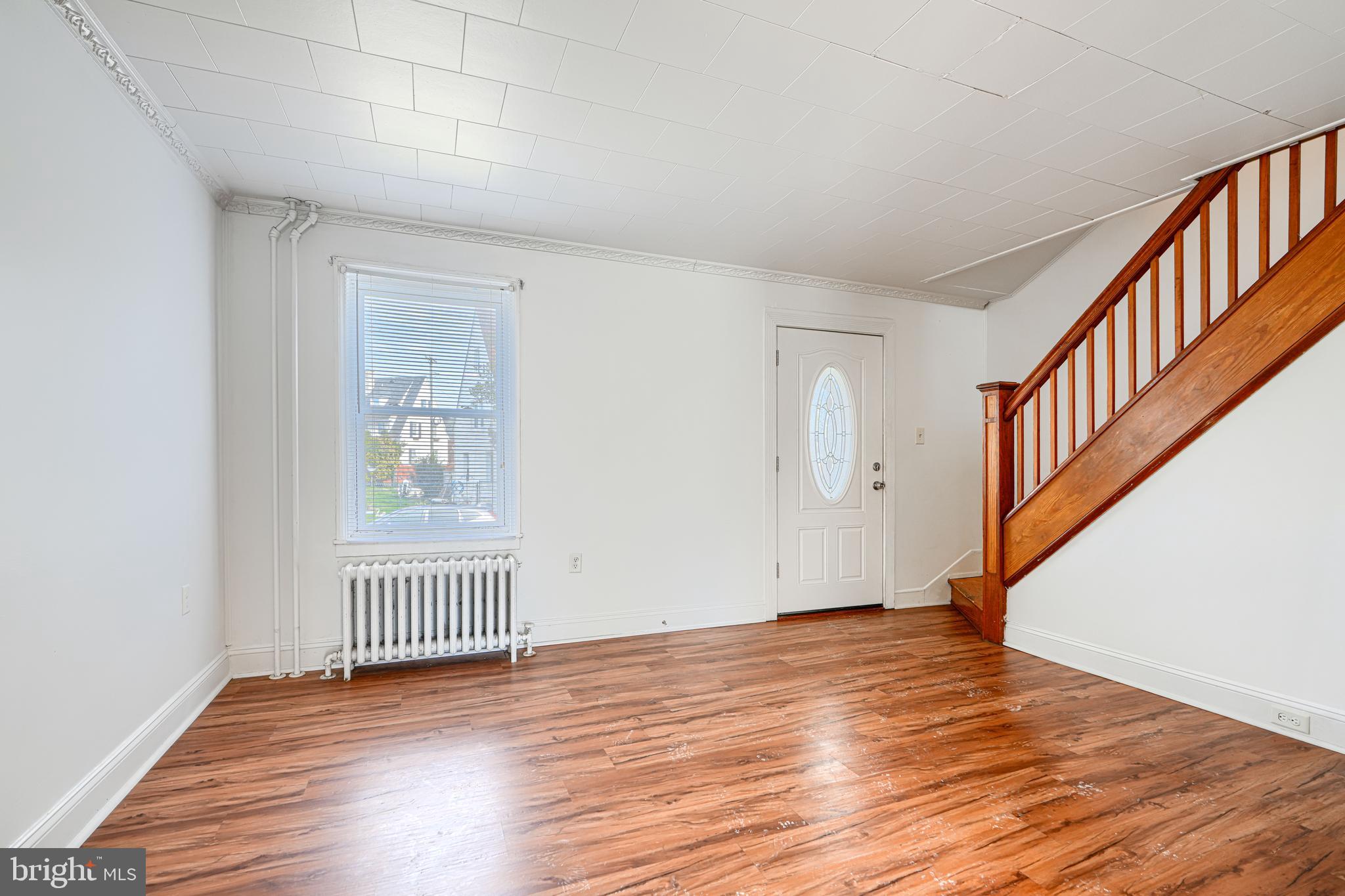 30 Portship Road Baltimore, MD 21222 - Photo 2 of 33 an empty room with wooden floor and windows