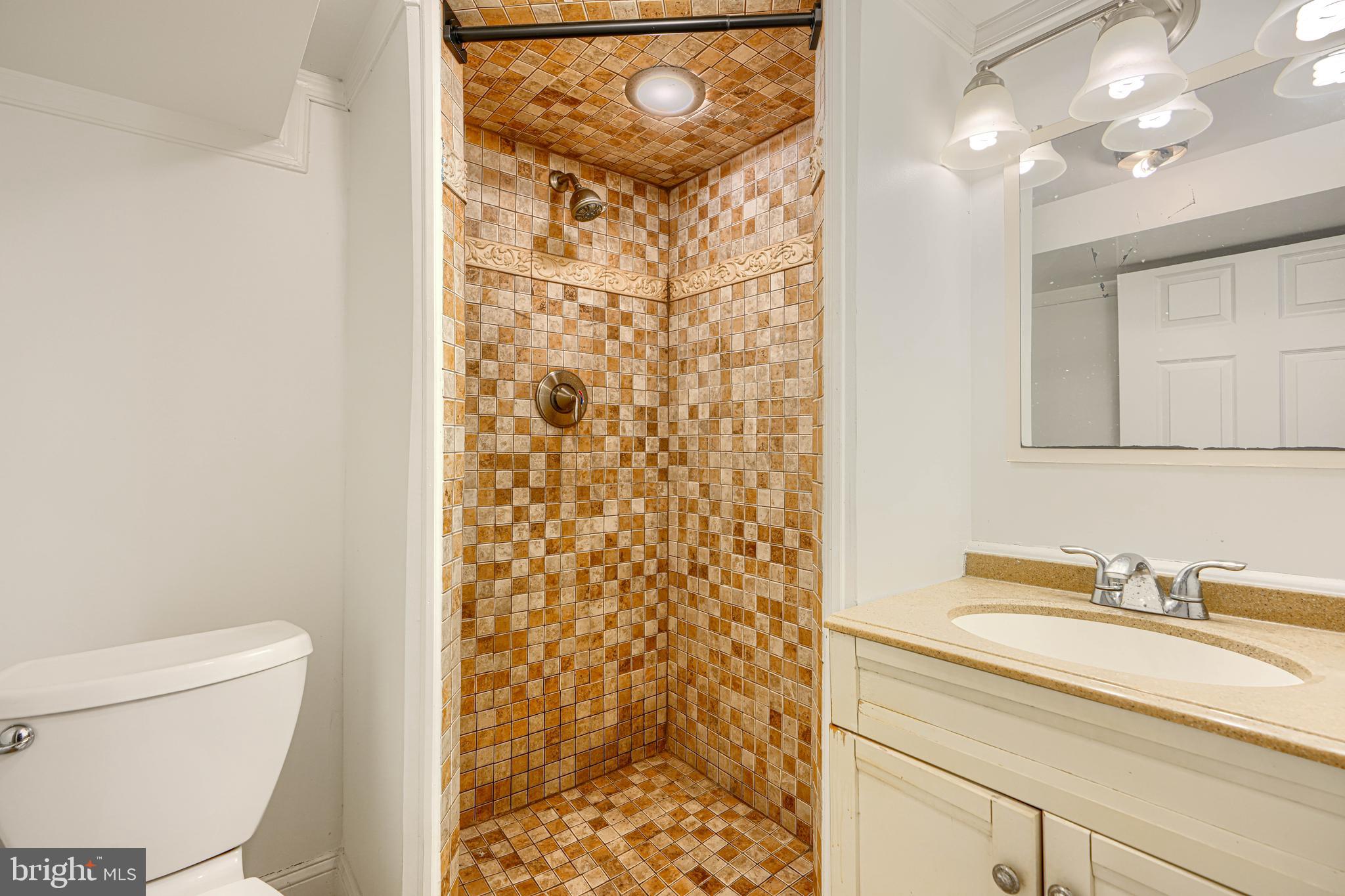 30 Portship Road Baltimore, MD 21222 - Photo 24 of 33 a bathroom with a sink toilet and shower