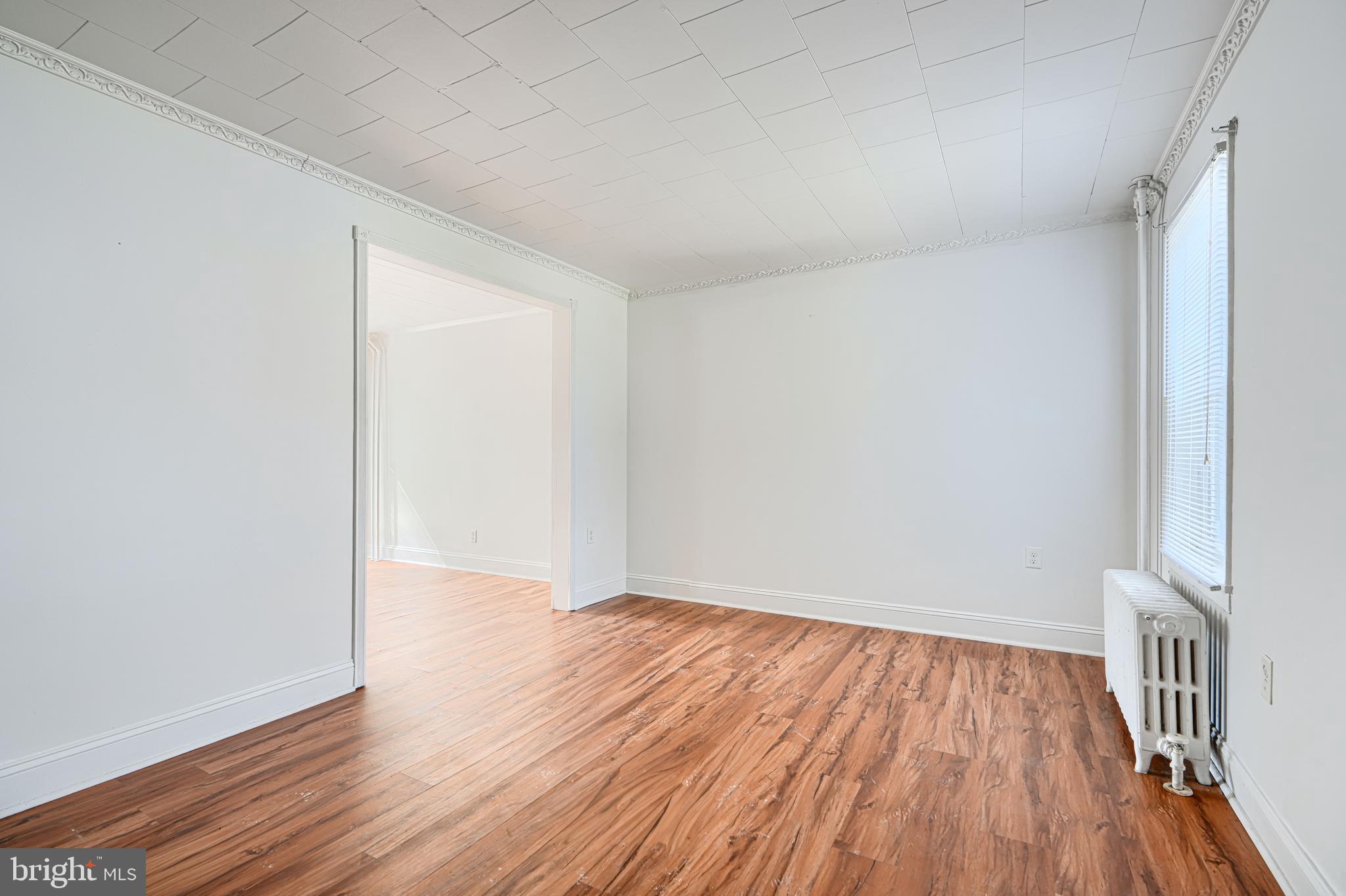 30 Portship Road Baltimore, MD 21222 - Photo 3 of 33 a view of an empty room with wooden floor