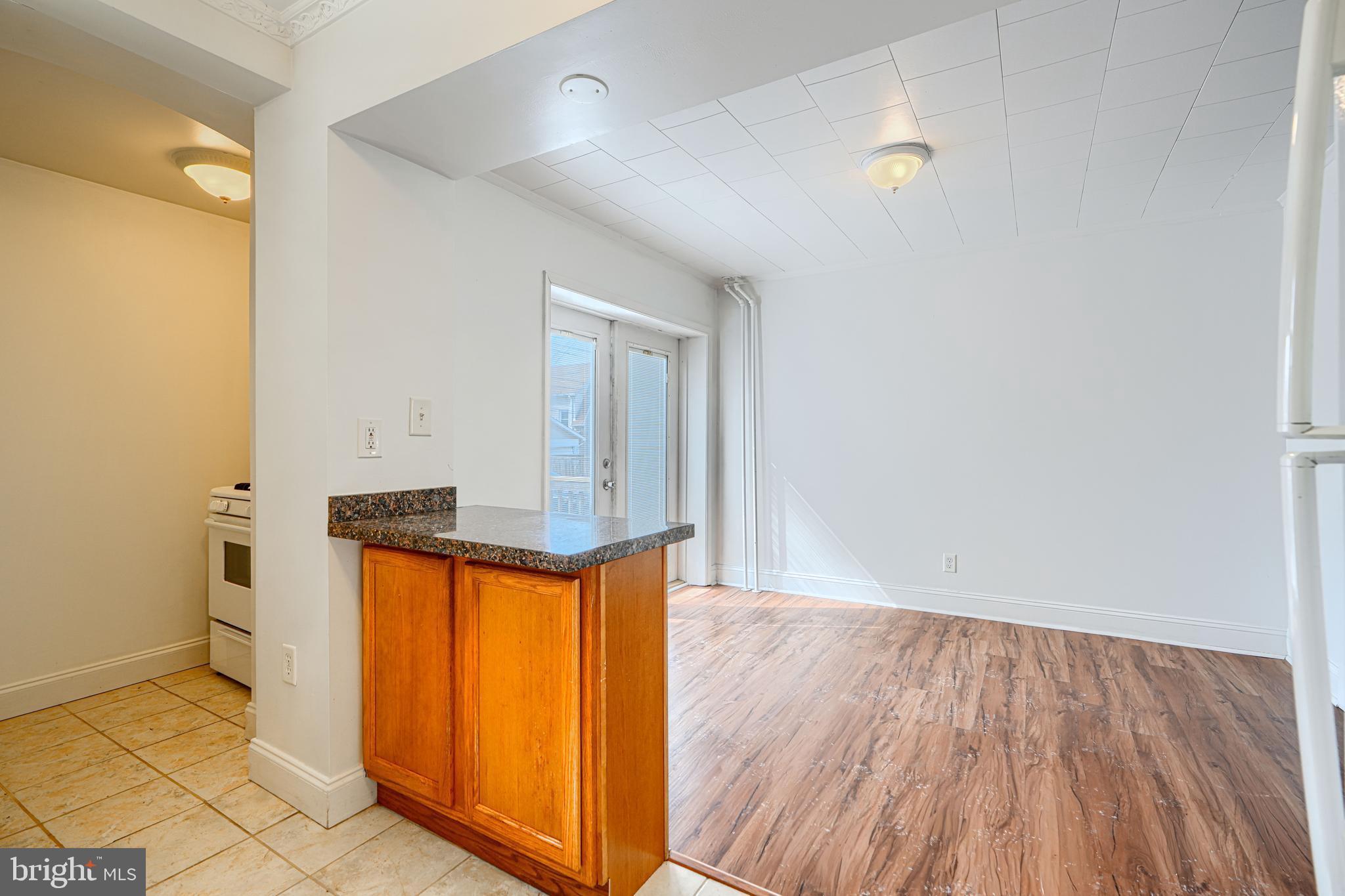 30 Portship Road Baltimore, MD 21222 - Photo 6 of 33 an empty room with wooden floor and a sink