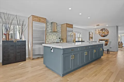 a bathroom with a sink double vanity and a mirror