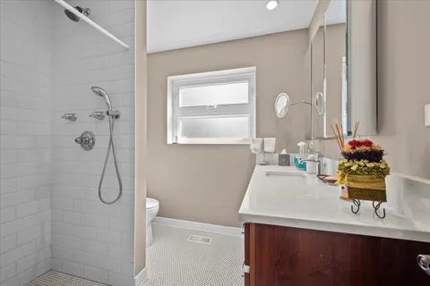 a bathroom with a sink vanity and a mirror