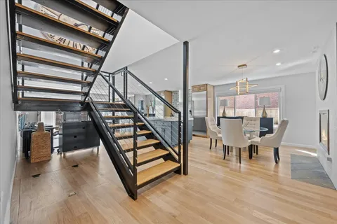 a view of entryway dining room and hall with wooden floor