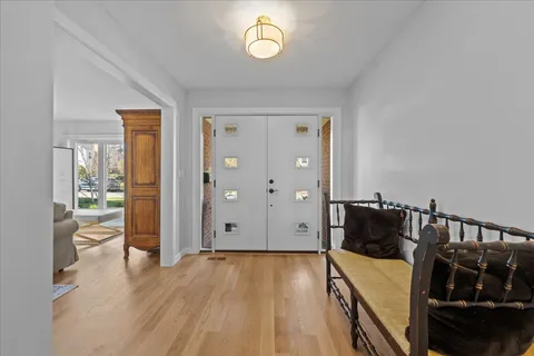 a view of a livingroom with furniture and hardwood floor