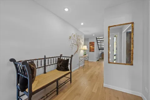 a bedroom with furniture and wooden floor