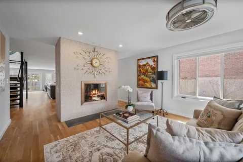 a living room with furniture a couch and a fireplace