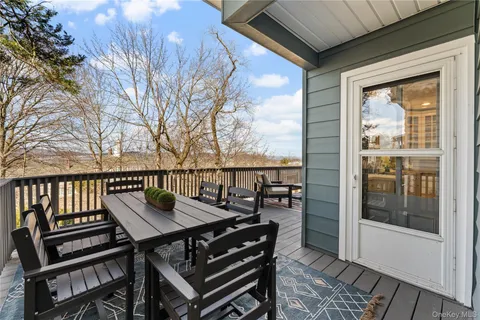 a view of a balcony with chairs