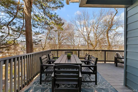 a view of a chairs and table on the deck