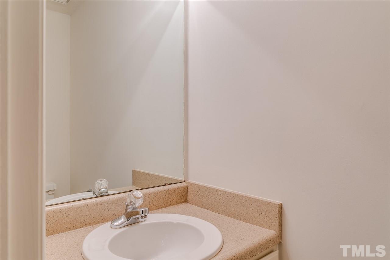 4213 Knightsbridge Way Raleigh, NC 27604 - Photo 12 of 23 a bathroom with a sink and a mirror