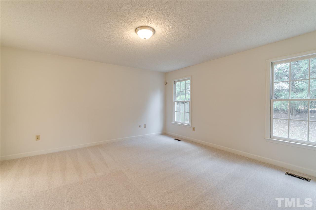 4213 Knightsbridge Way Raleigh, NC 27604 - Photo 13 of 23 an empty room with windows