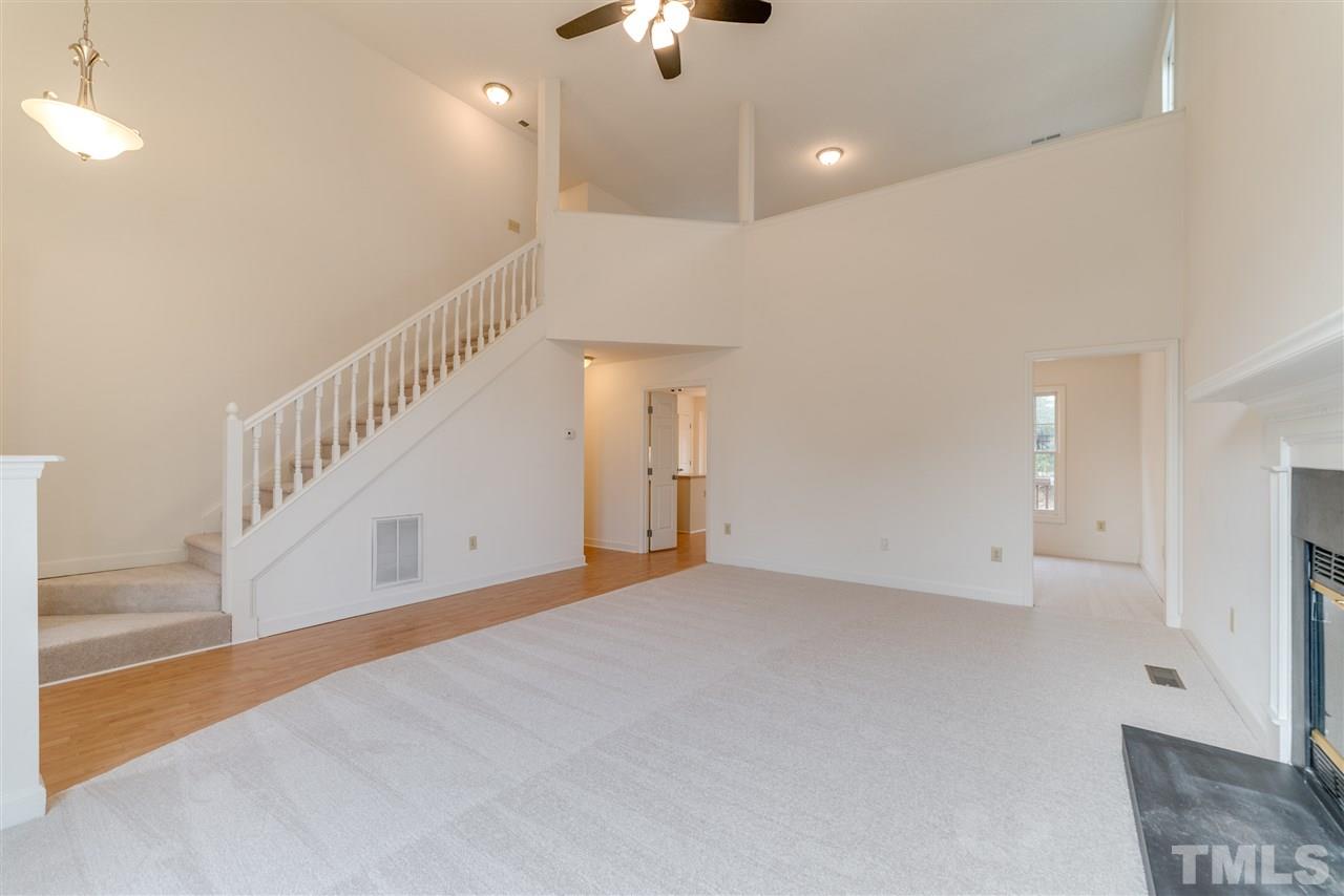 4213 Knightsbridge Way Raleigh, NC 27604 - Photo 3 of 23 a view of an empty room with a chandelier fan
