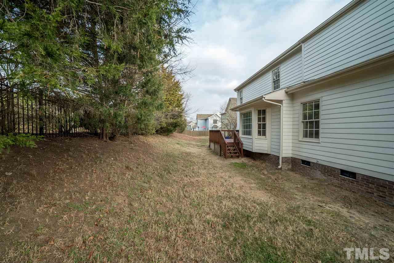 4213 Knightsbridge Way Raleigh, NC 27604 - Photo 22 of 23 a view of a house with a backyard