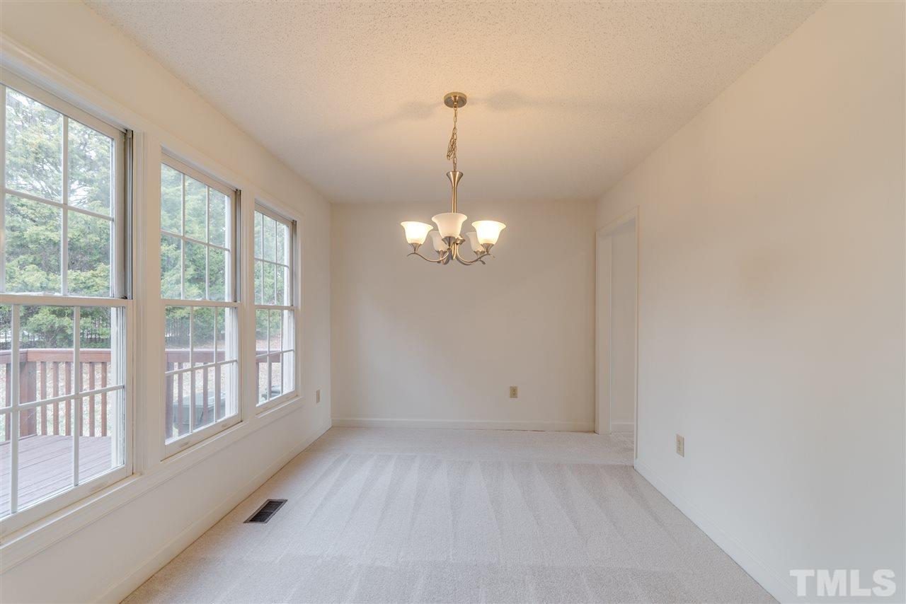 4213 Knightsbridge Way Raleigh, NC 27604 - Photo 7 of 23 a view of an empty room with a window