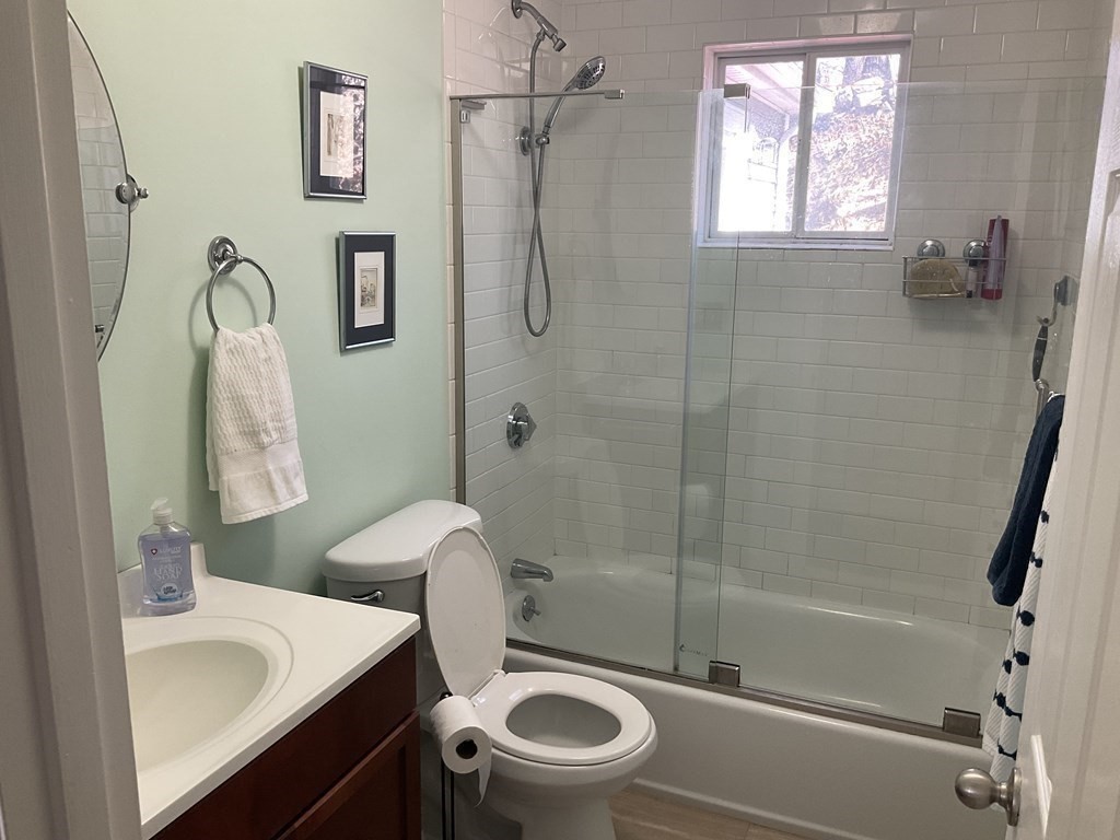 18 Ridgeway Street Dedham, MA 02026 - Photo 12 of 24 a bathroom with a sink toilet and shower
