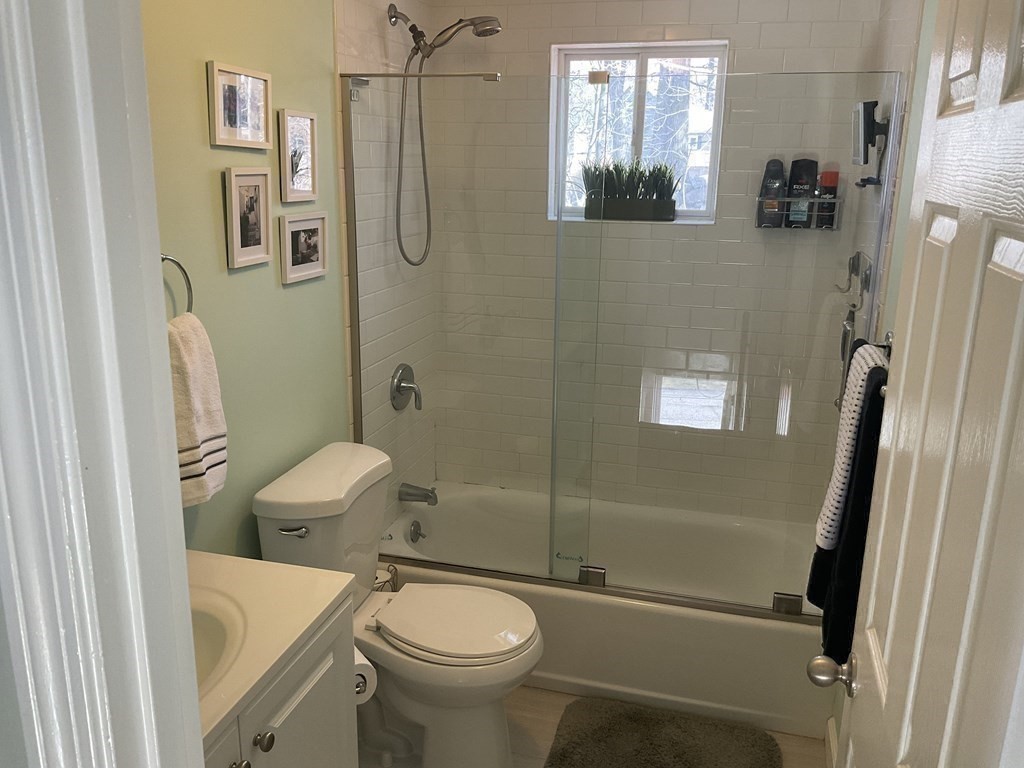 18 Ridgeway Street Dedham, MA 02026 - Photo 16 of 24 a bathroom with a sink a toilet and shower