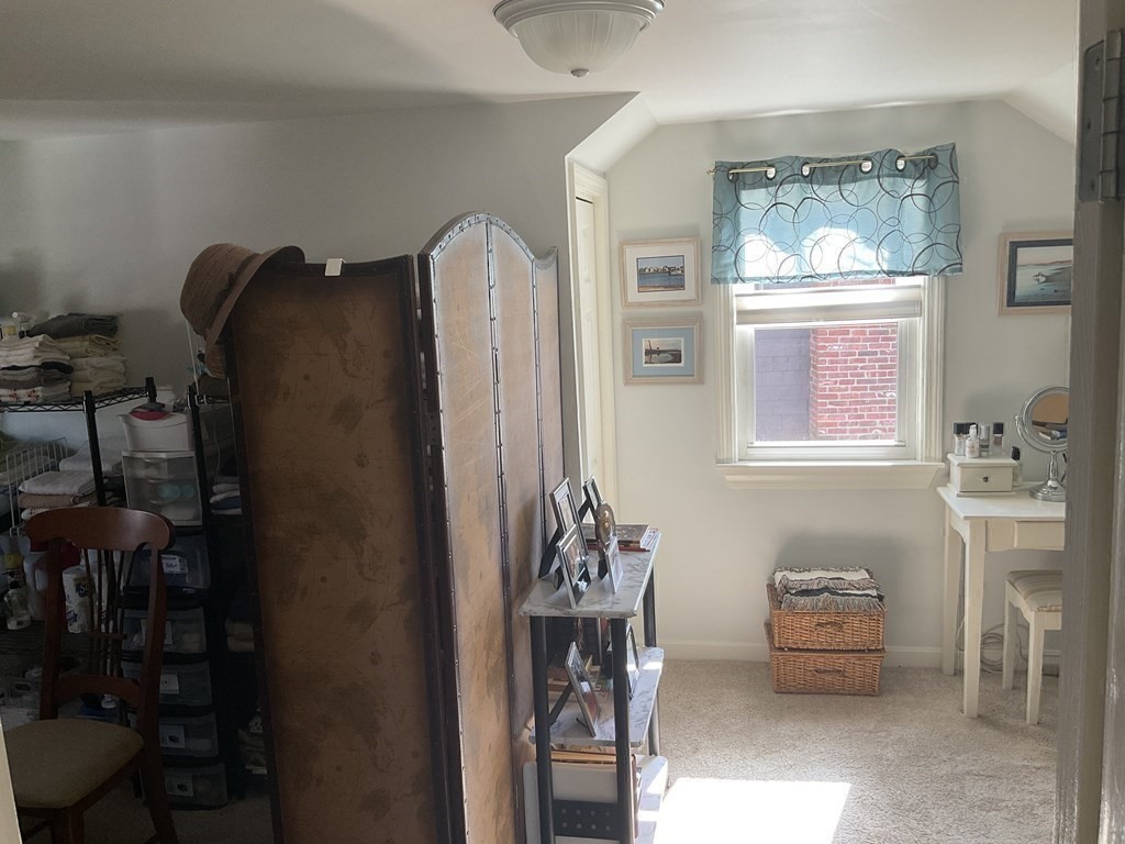 18 Ridgeway Street Dedham, MA 02026 - Photo 18 of 24 a bedroom with furniture and a window