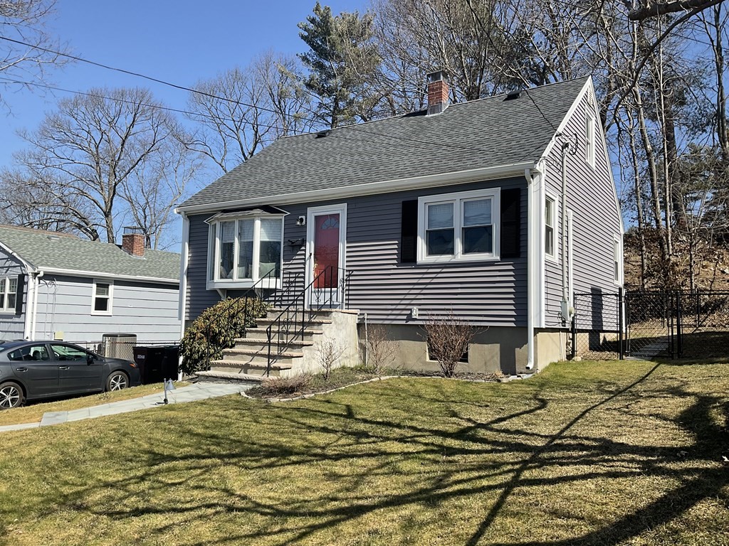 18 Ridgeway Street Dedham, MA 02026 - Photo 2 of 24 a front view of a house with a yard