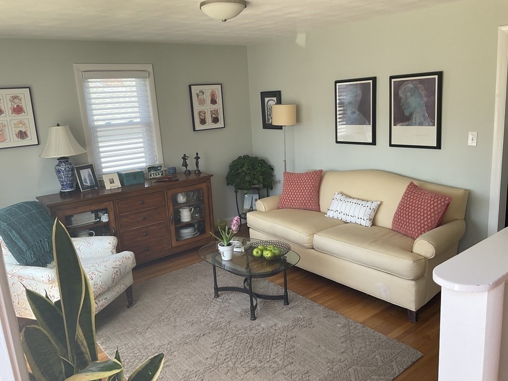 18 Ridgeway Street Dedham, MA 02026 - Photo 6 of 24 a living room with furniture a couch and paintings on the wall