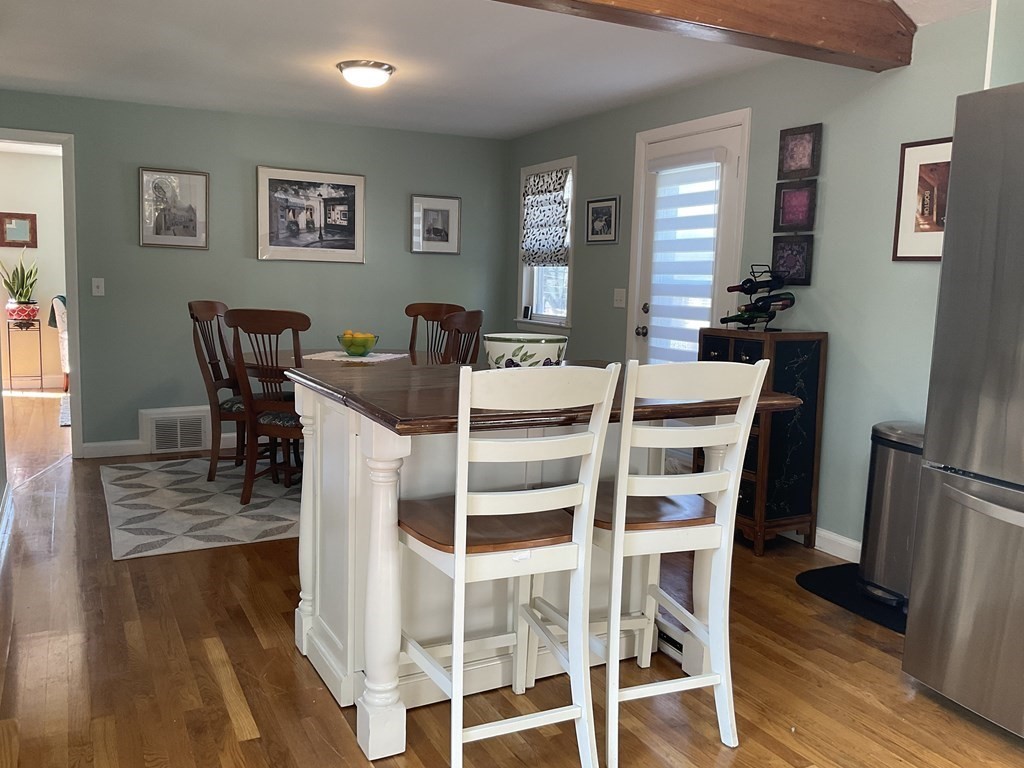 18 Ridgeway Street Dedham, MA 02026 - Photo 7 of 24 a view of a dining room with furniture and wooden floor