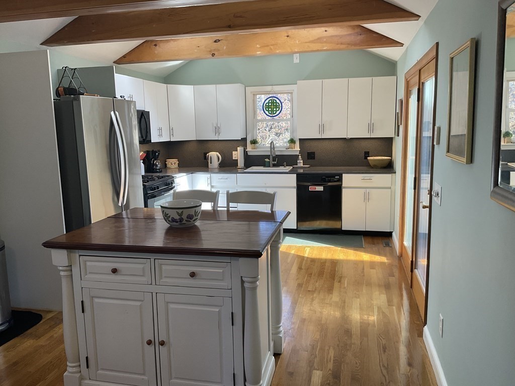 18 Ridgeway Street Dedham, MA 02026 - Photo 8 of 24 a kitchen with stainless steel appliances granite countertop a refrigerator and a stove top oven