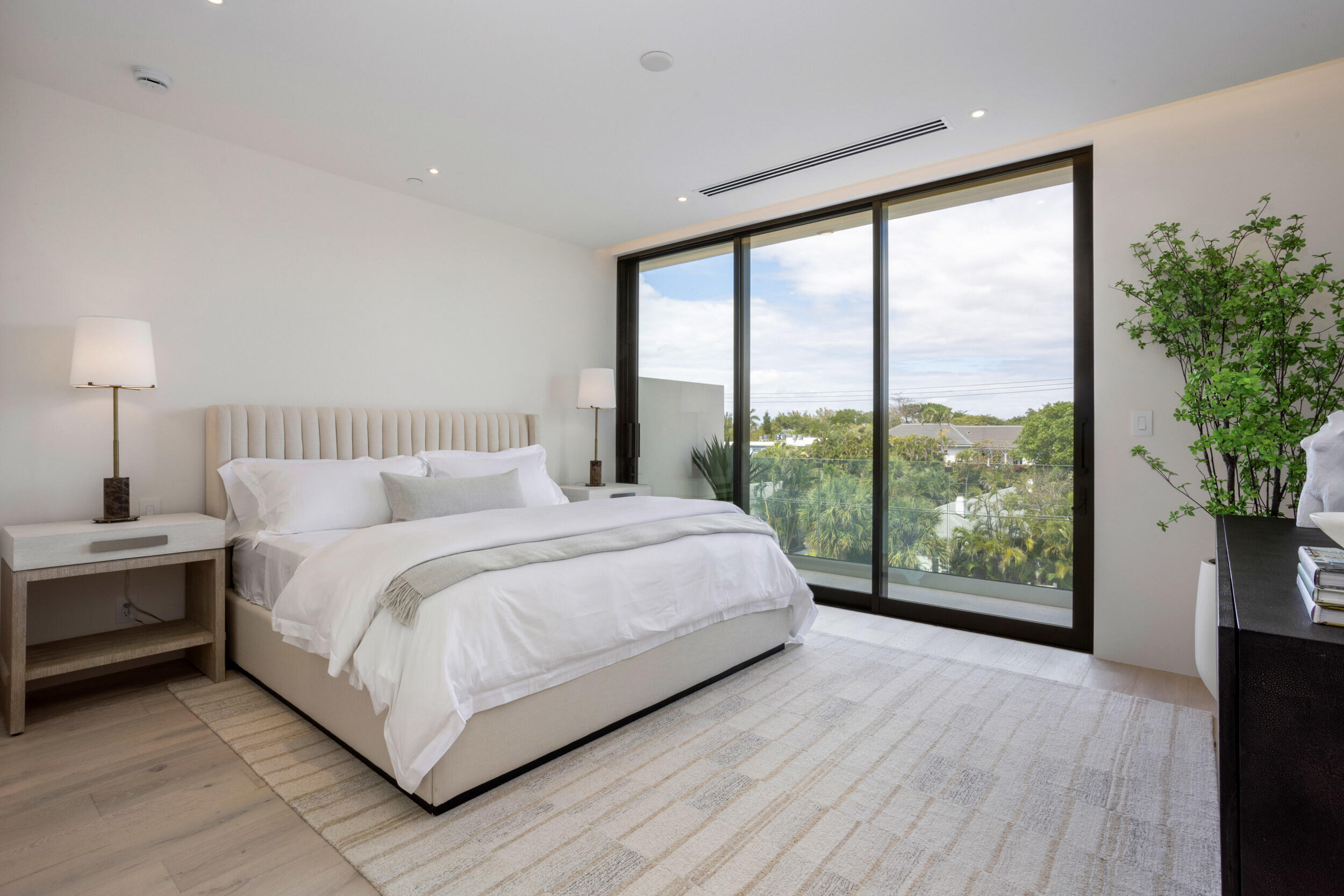 1246 George Bush Boulevard Delray Beach, FL 33483 - Photo 36 of 63 a bedroom with a large bed and a large window