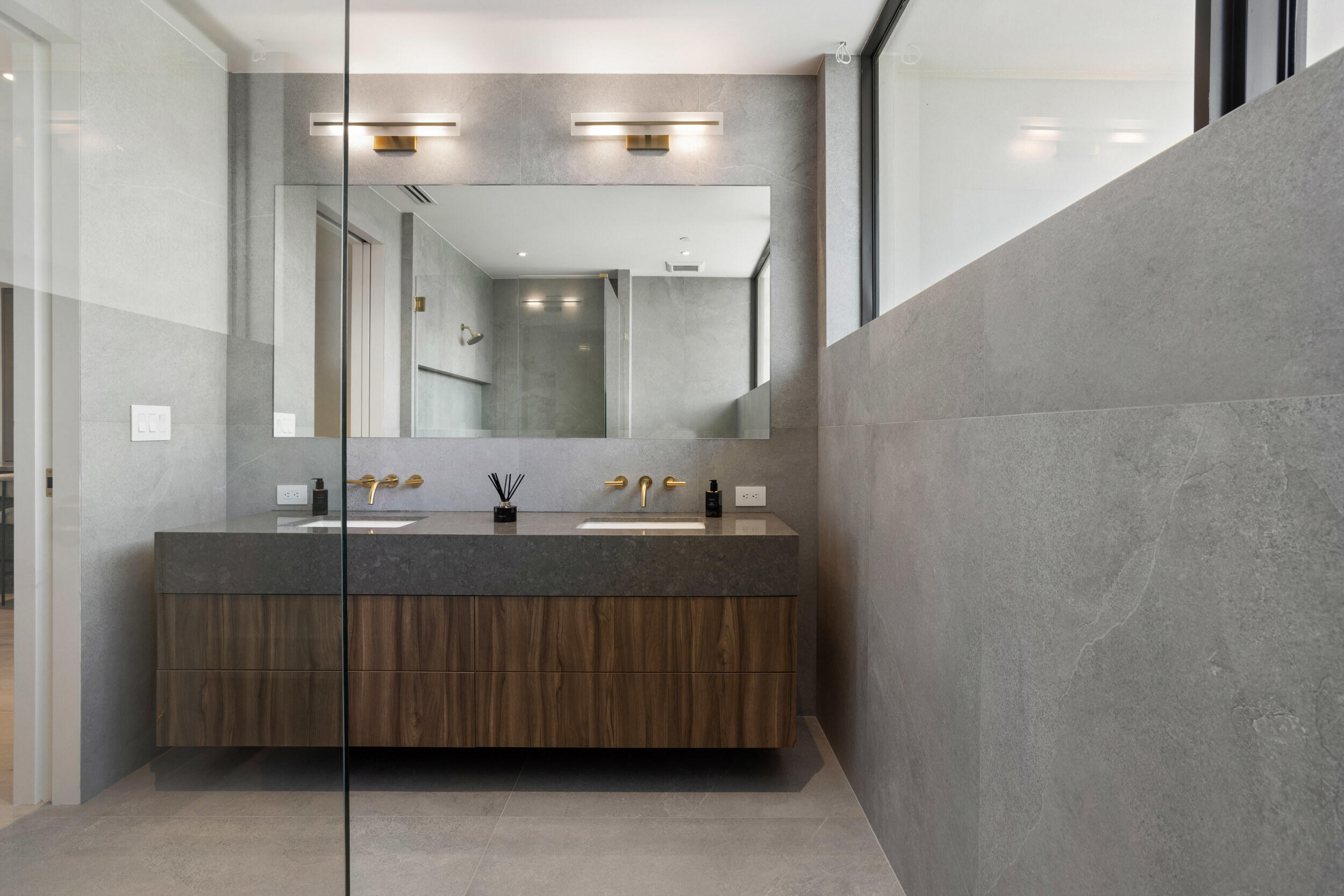 1246 George Bush Boulevard Delray Beach, FL 33483 - Photo 44 of 63 a bathroom with a sink and a mirror