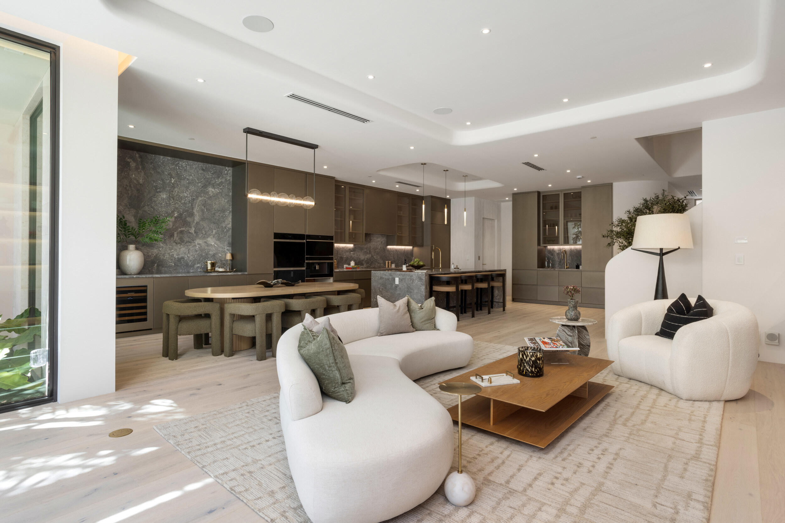 1246 George Bush Boulevard Delray Beach, FL 33483 - Photo 7 of 63 a living room with furniture and kitchen view