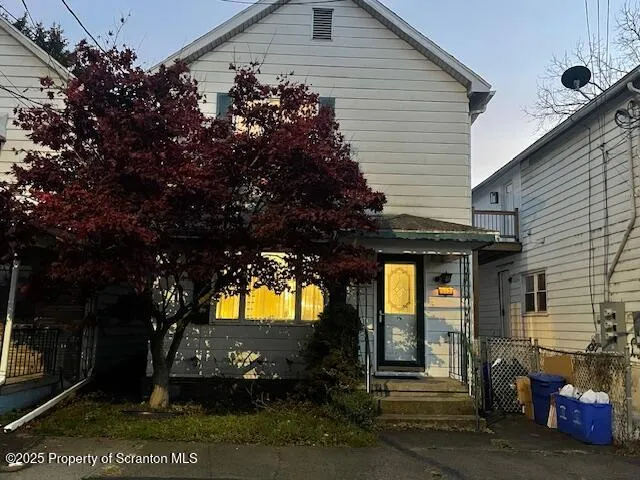a view of a house with a tree