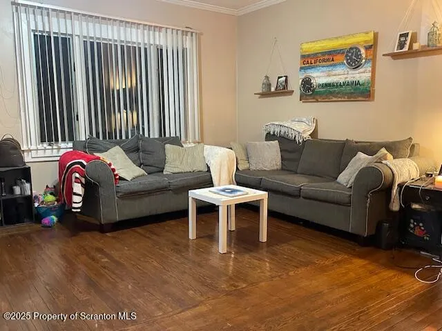 a living room with furniture and a table