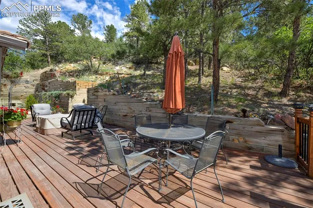 a view of a chairs and table on the wooden floor