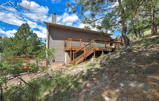 a view of an house with backyard space and patio