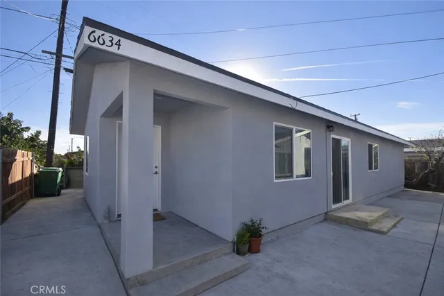 a backyard of a house with sofas