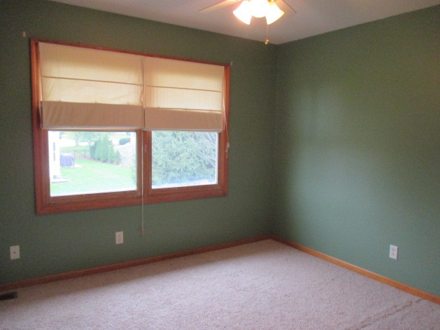 802 Ridge Drive Elburn, IL 60119 - Photo 10 of 14 an empty room with a window