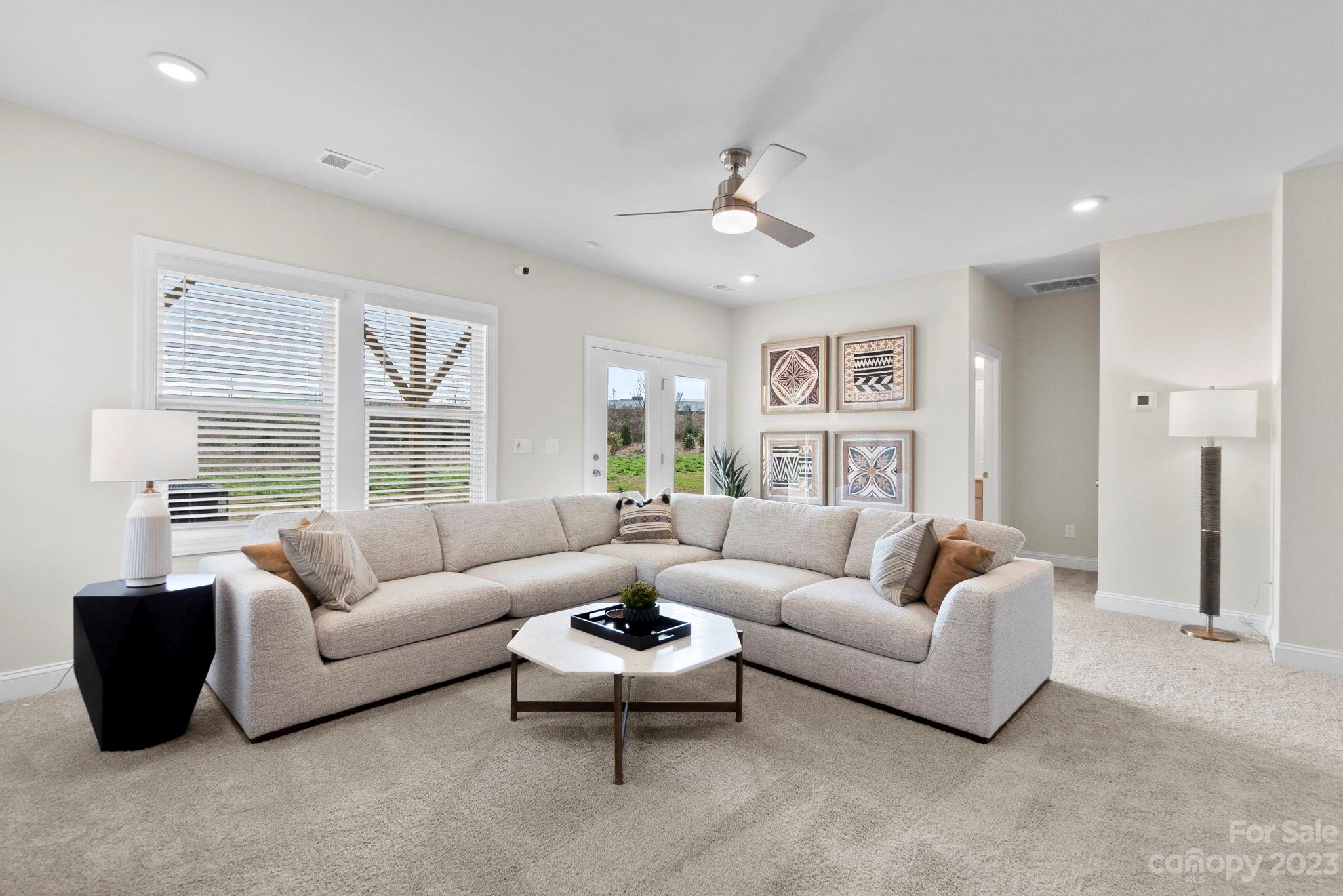 4513 Forsyth Place Fort Mill, SC 29708 - Photo 23 of 24 a living room with furniture and a large window